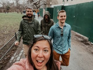 the four of us walking through Central Park on a rainy day