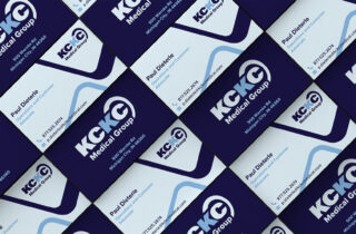kckc medical's business cards on display, front & back, at an angle